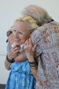 A man hugging his wife